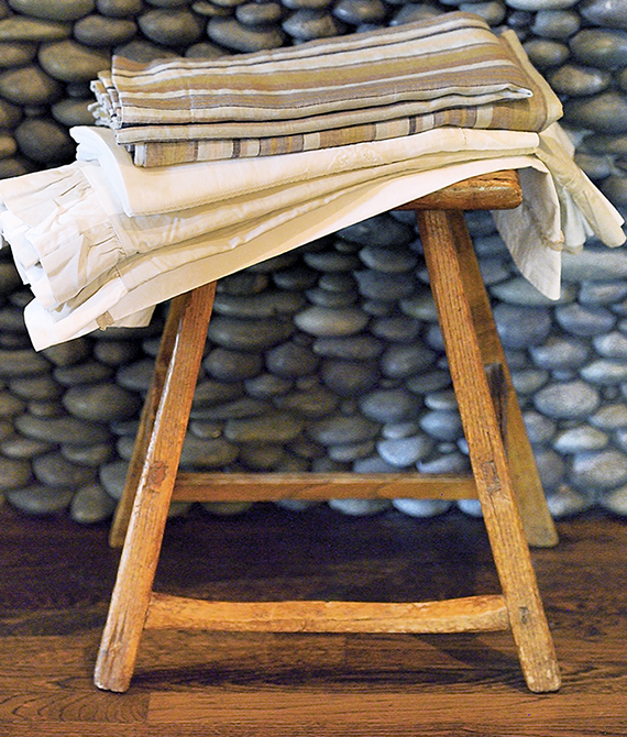 Towels Stacked on Wood Stool